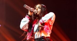 Wande sits courtside for a Orlando Magic’s playoff game